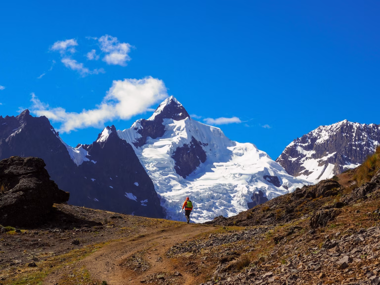 Trekking over the Ipsaycocha high altitude pass during the Lares expedition.