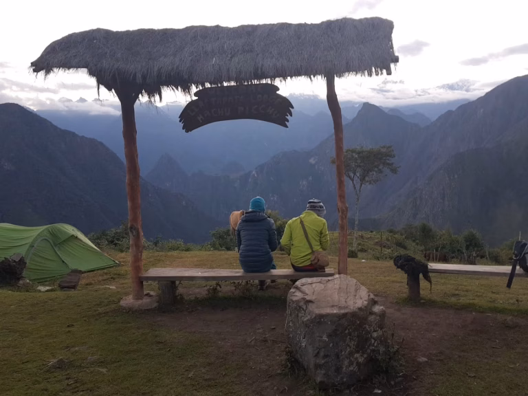 Rare distant view of Machu Picchu citadel from the Llactapata Inca ruins.