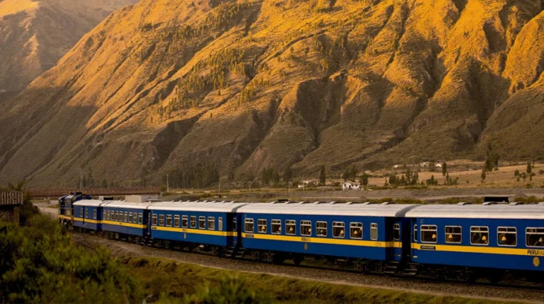 Train running by the track to Machu Picchu